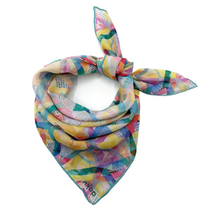 Hand-illustrated cotton bandana with colorful neon floral pattern on black background – Chromarama by Doku, eco-friendly and sustainably made